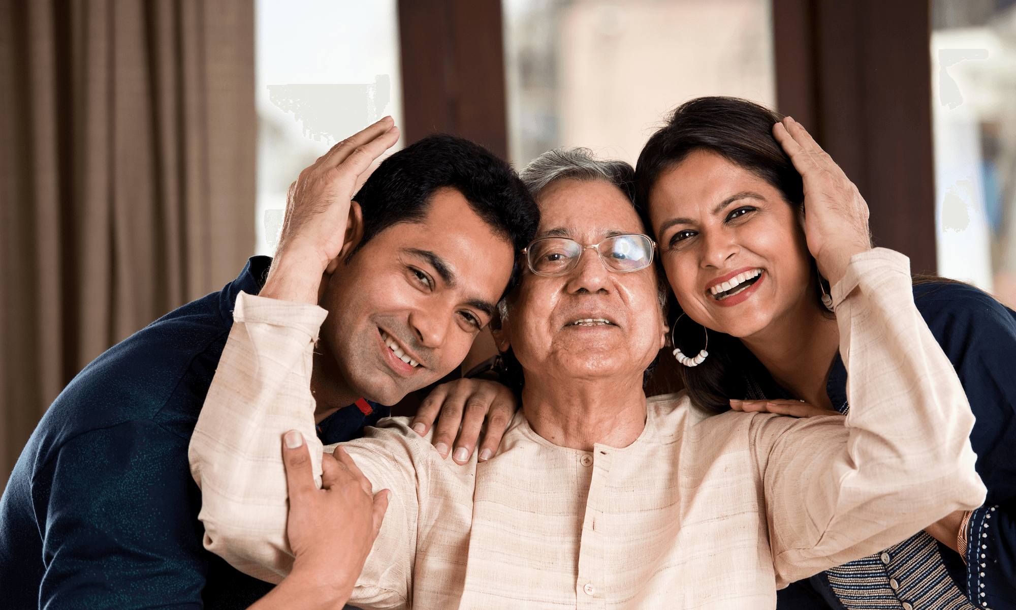 Family gathered with an older loved one, representing private nursing support for individuals and families